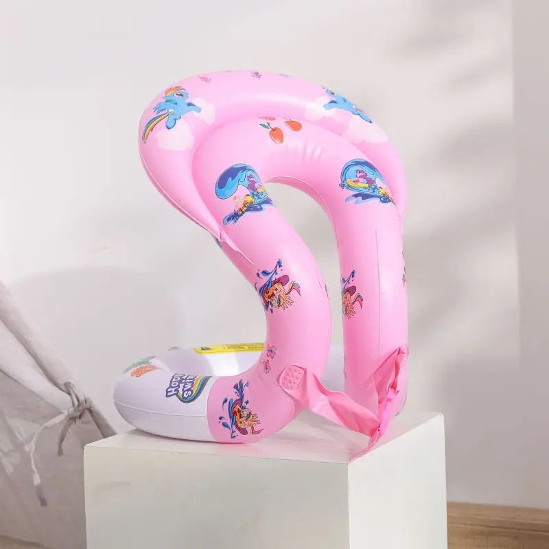 A pink inflatable swim neck ring with playful illustrations, displayed upright on a white stand.