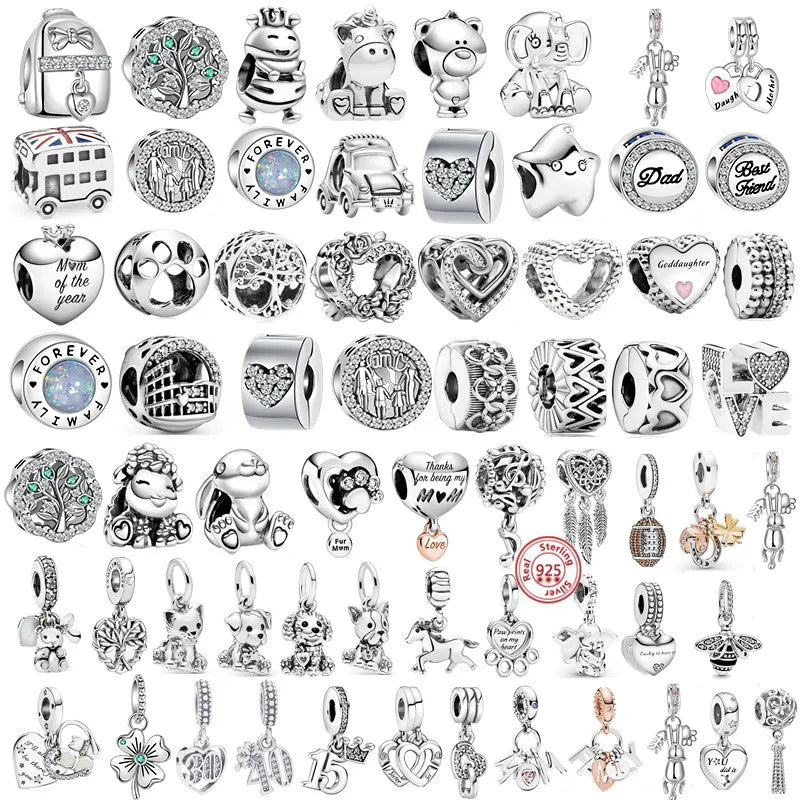 a large collection of silver charms, each with various designs and themes. The charms include shapes like hearts, animals, symbols, and words, with some adorned with gemstones or enamel detailing. They appear to be designed for bracelets, such as those used in charm bracelets, and each charm has a unique and intricate design.