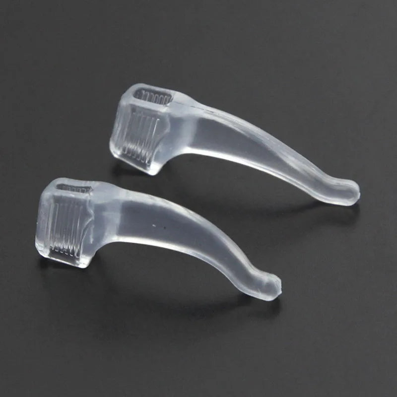 Two Transparent Anti-Slip Eyeglass Ear Grips displayed on Gray background.